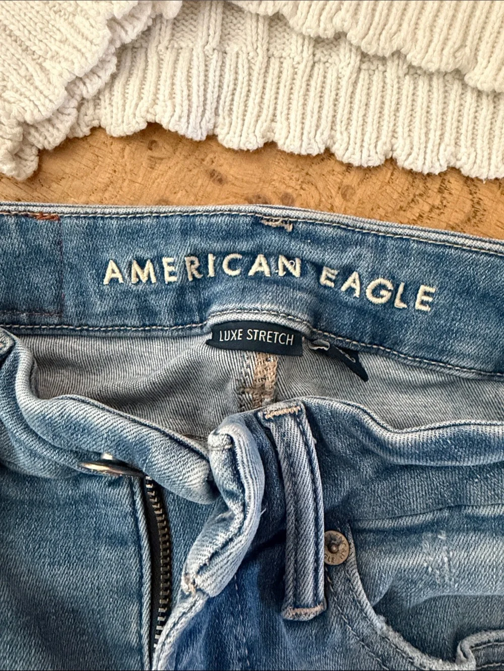 American Eagle Outfitters Skinny Jeans Paired with Button Down Sweater